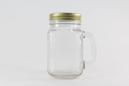 Glass jars isolate on white backgroundの写真素材