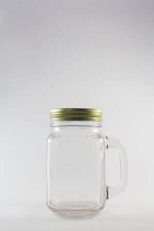 Glass jars isolate on white backgroundの写真素材