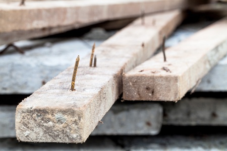 sharp rusty nail stick on woodの写真素材