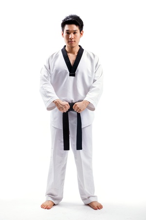 taekwondo action isolated by a young manの写真素材