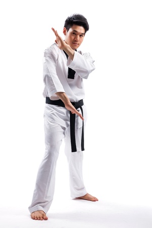 taekwondo action isolated by a young manの写真素材
