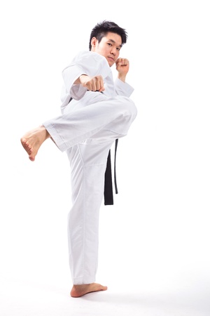 taekwondo action isolated by a young manの写真素材