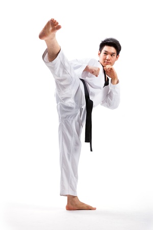 taekwondo action isolated by a young manの写真素材