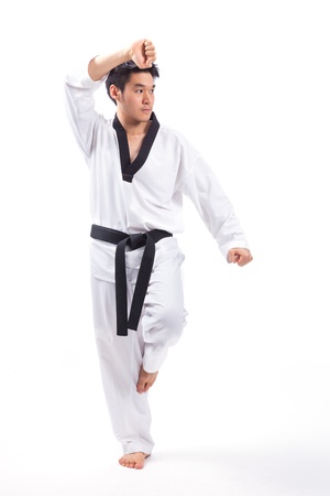 taekwondo action isolated by a young manの写真素材