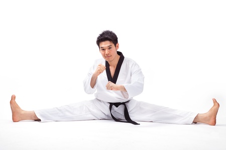 taekwondo action isolated by a young manの写真素材