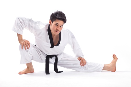 taekwondo action isolated by a young manの写真素材