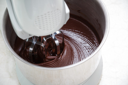 mixing chocolate dough with dough mixerの写真素材
