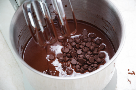 mixing chocolate dough with dough mixerの写真素材