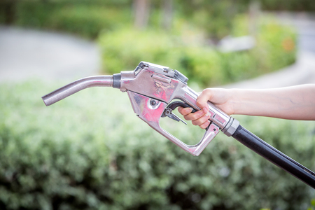 clean fuel nozzle in handの写真素材