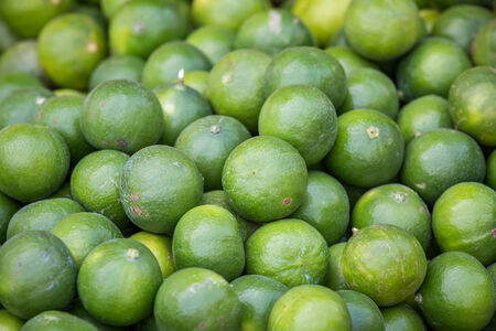 close up of green lime in the supermarketの写真素材