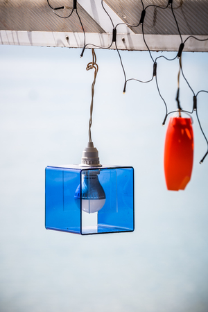 creative bulb lamp hanging on crossbeamの写真素材