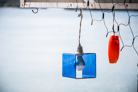 creative bulb lamp hanging on crossbeamの写真素材