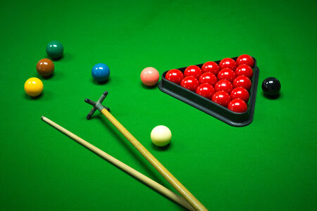snooker balls set on a green table