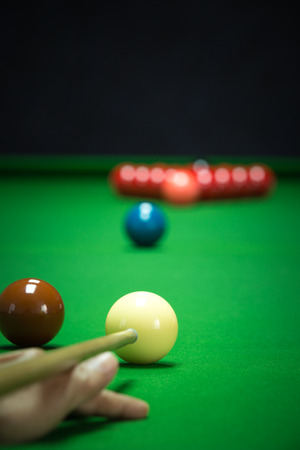 snooker balls set on a green tableの写真素材