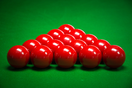 snooker balls set on a green table