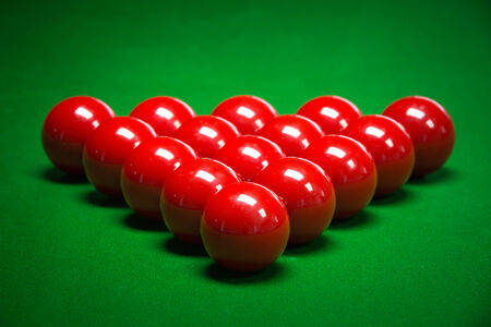snooker balls set on a green tableの写真素材