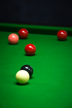 snooker balls set on a green tableの写真素材