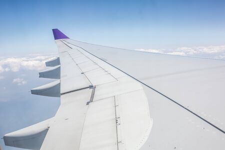 aeroplane wing in the skyの写真素材
