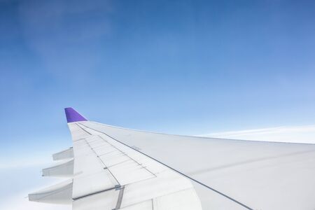 aeroplane wing in the skyの写真素材