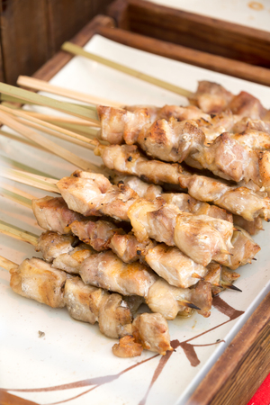 close up of thai style grill pork in bamboo stickの写真素材