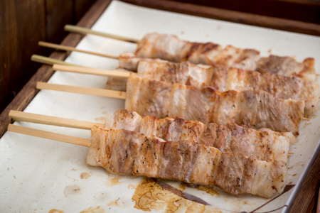 close up of thai style grill pork in bamboo stickの写真素材