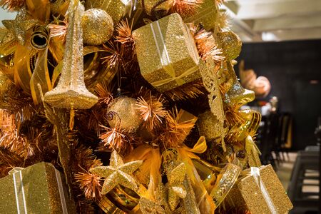 close up of sparkling golden christmas tree ornamentの写真素材