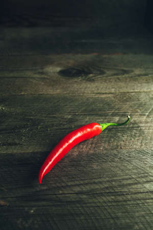 Macro photo of Organic Chili Pepper on a wooden tableの写真素材