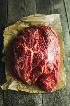 Fresh red Raw meat on a wooden backgroundの写真素材