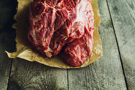 Fresh red Raw meat on a wooden backgroundの写真素材