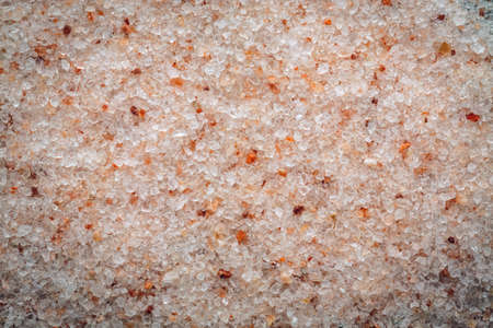 Pink Himalayan salt macro background texture. Top view