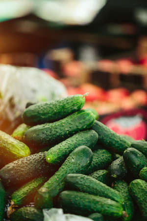 Heap Green cucumbers at Farmers' marketの写真素材