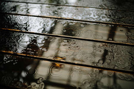 Calm photo of Rain drops on burn hardwood floorの写真素材