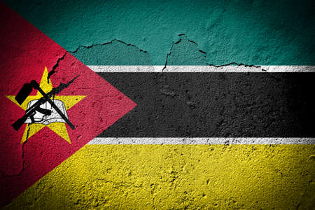 Mozambique flag painted on grungy cracked wallの写真素材