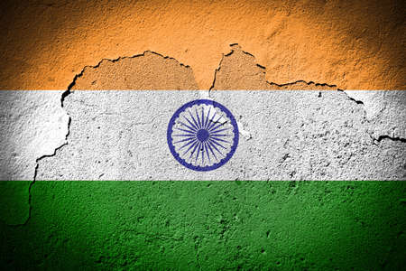 India flag painted on grungy cracked wallの写真素材