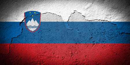 Slovenia flag painted on grungy cracked wallの写真素材