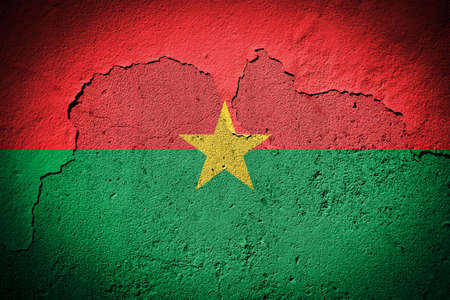 Burkina Faso flag painted on grungy cracked wallの写真素材