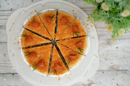 beautiful Salted Egg Cheesecake on a wooden deskの写真素材