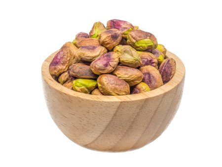 isolate of pistachio in a wooden bowlの写真素材
