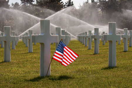 American flag on Omaha Beach Cemetry commemorating fallen soldiers in WW II - Omaha was the code...
