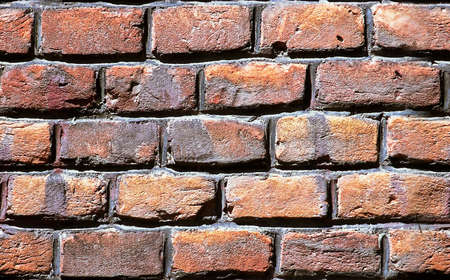 Close up view on repetitive grunge brick wall textureの写真素材