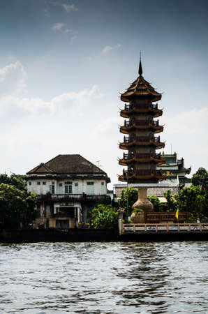 The House and chinese pagoda rim chao phra ya river at Bangkok Thailand のeditorial素材