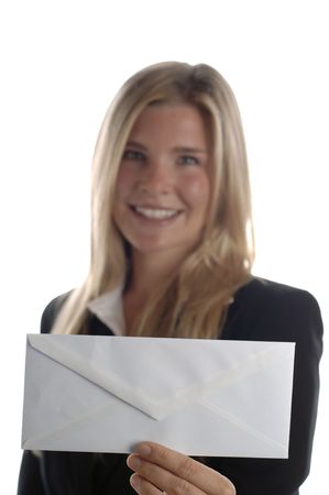 Young energetic business woman smiles as she holds blank envelope.の写真素材