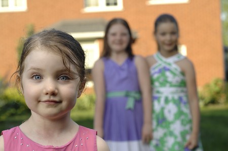 Cute girls play in the garden.の写真素材