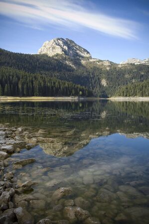 Reflection of the mountain peak on the lakeの写真素材