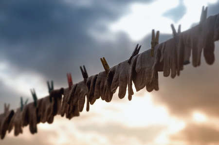 Drying gloves on the rope after intensive farm work