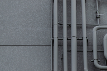 Pipeline system on gray wallの写真素材