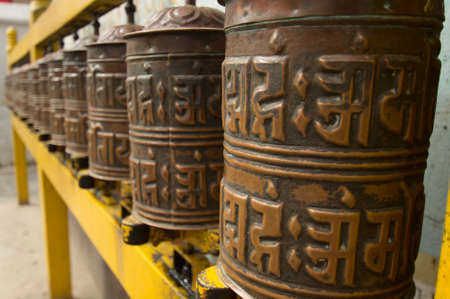 Prayer wheels by Bodhnath stupaの写真素材
