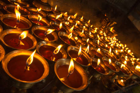Burning butter lamps in Kathmanduの写真素材