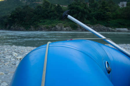 A raft next to the riverの写真素材