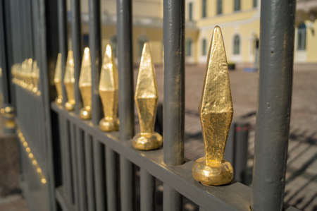 A gate with golden spikes in Helsinkiの写真素材